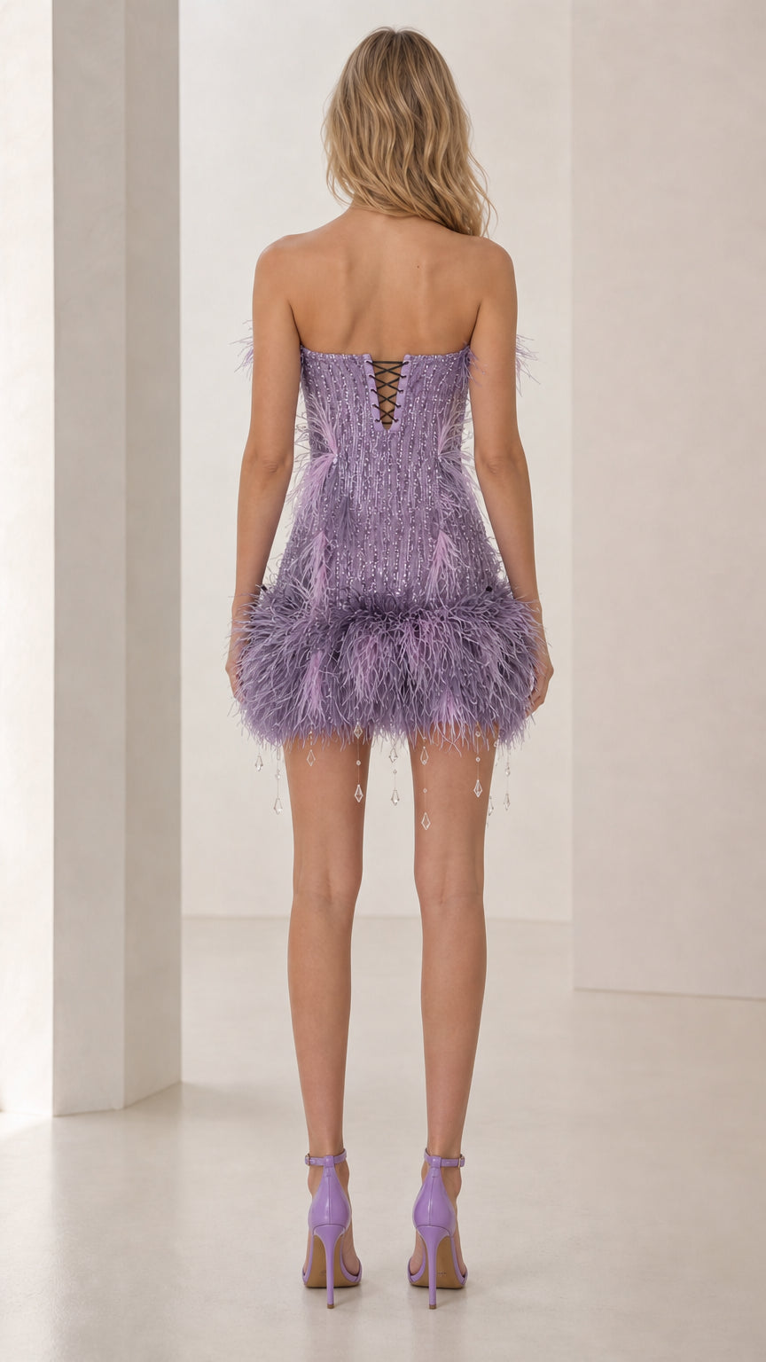 Back view showing lace-up corset details of lavender mini dress