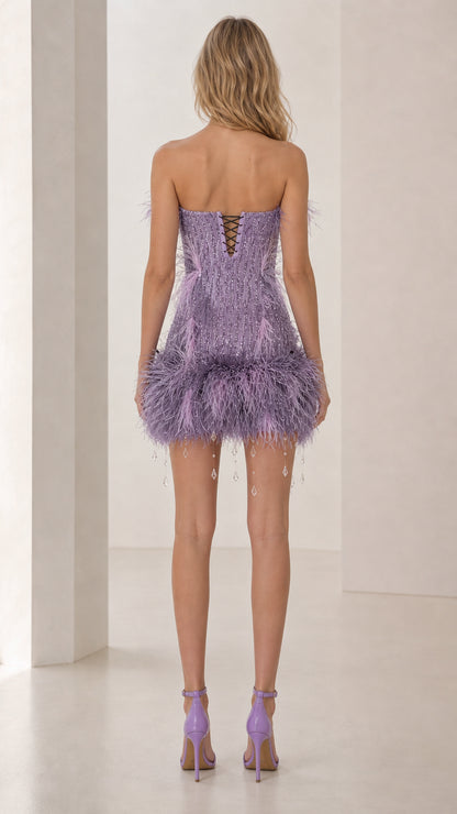 Back view showing lace-up corset details of lavender mini dress