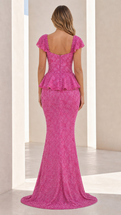 Back view of hot pink mermaid gown showing train