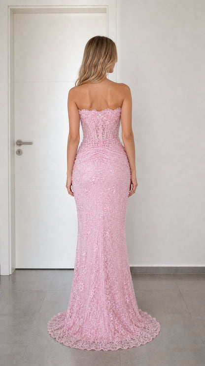 Back view of pink strapless evening gown with subtle train