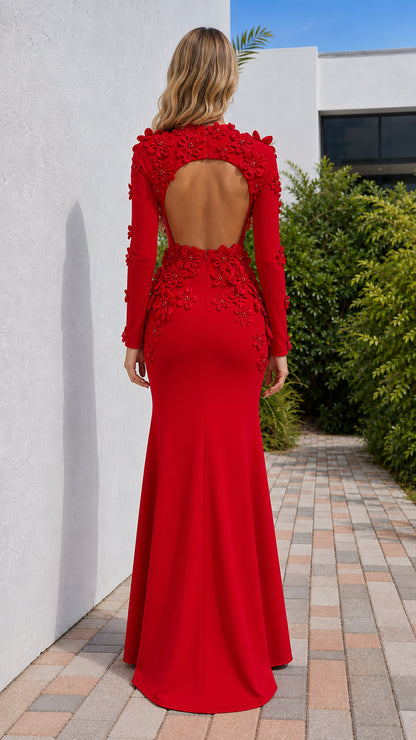 Back view of model showing open back detail on red evening dress