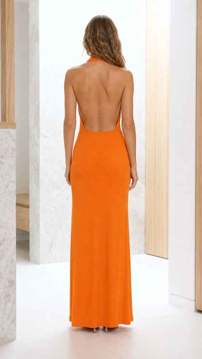 Back view showcasing open back design of orange dress