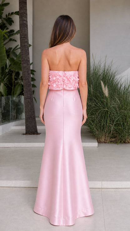 Back view of pink strapless maxi dress with floral overlay