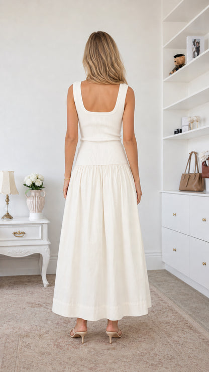 Back view of model in white square neck midi dress