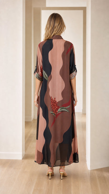 Back view of model wearing brown abstract floral maxi shirt dress