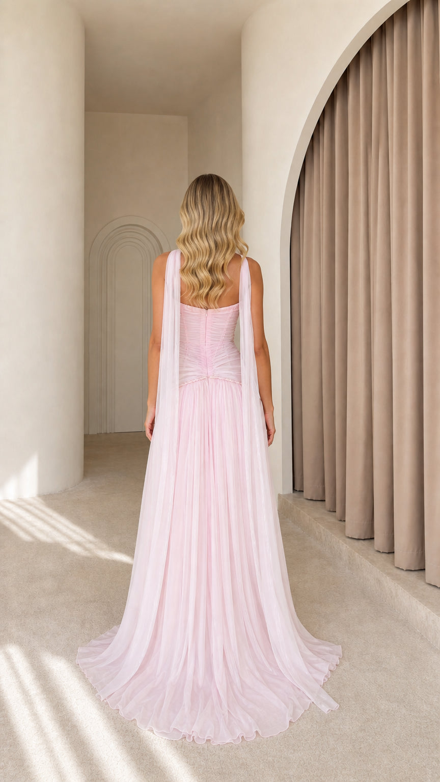 Back view of pink evening gown showing cascading cape panels
