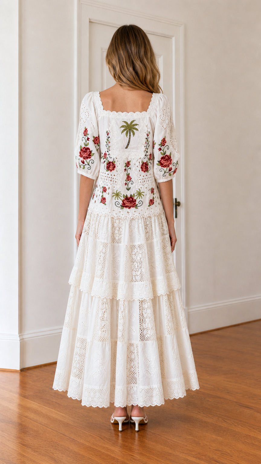 Back view of woman wearing white embroidered maxi dress