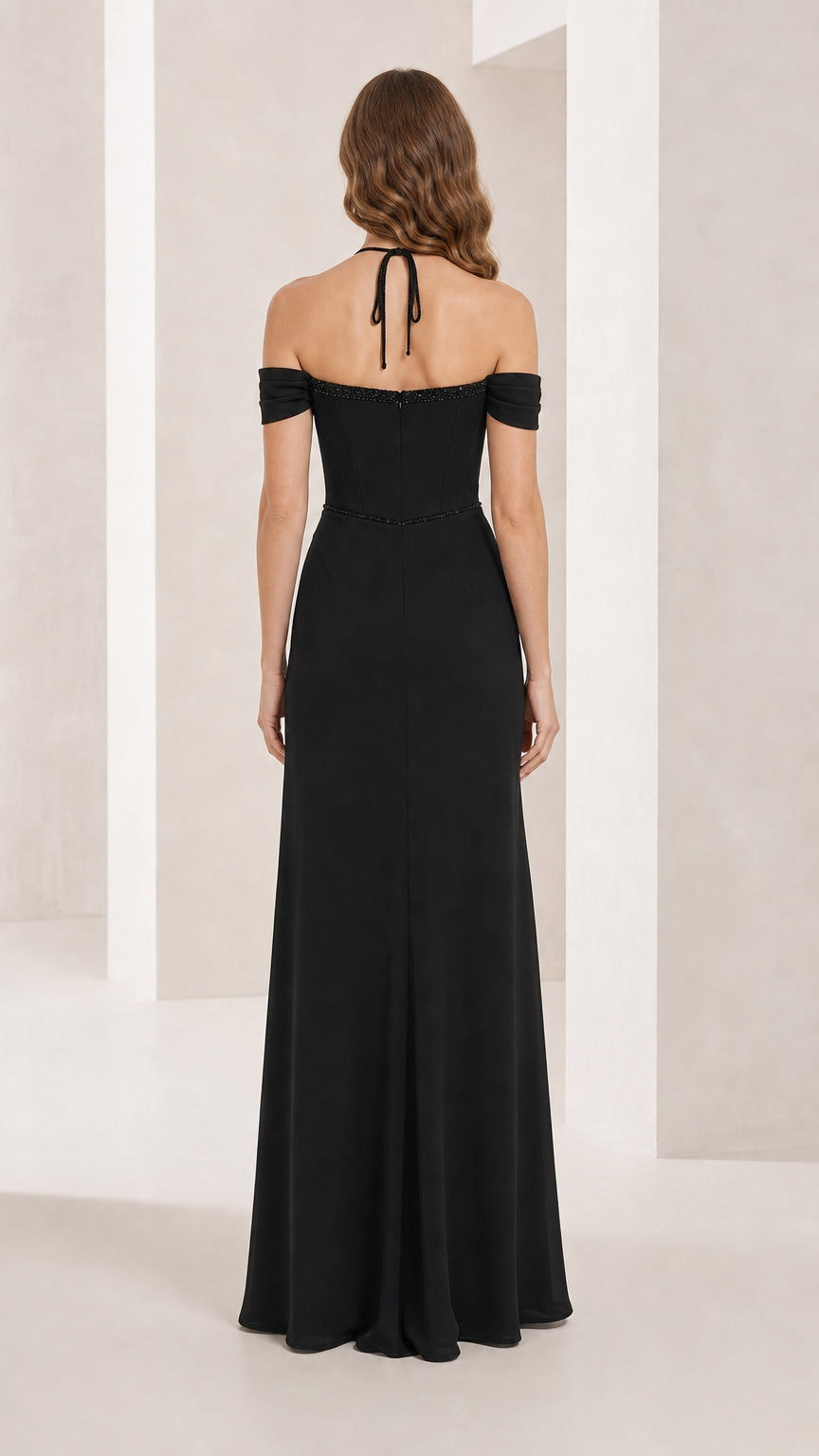 Back view of black formal gown with halter tie