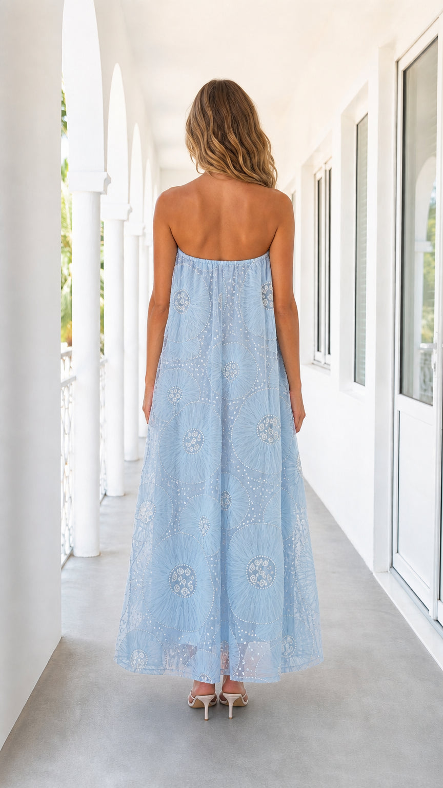 Back view of light blue strapless maxi dress