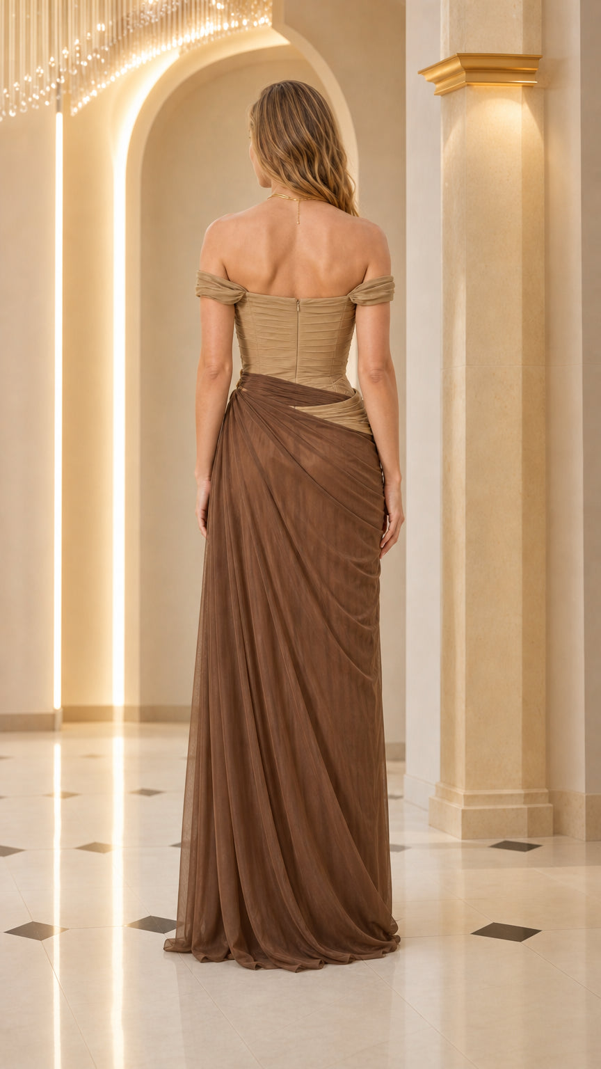 Back view of woman in brown off-shoulder maxi dress