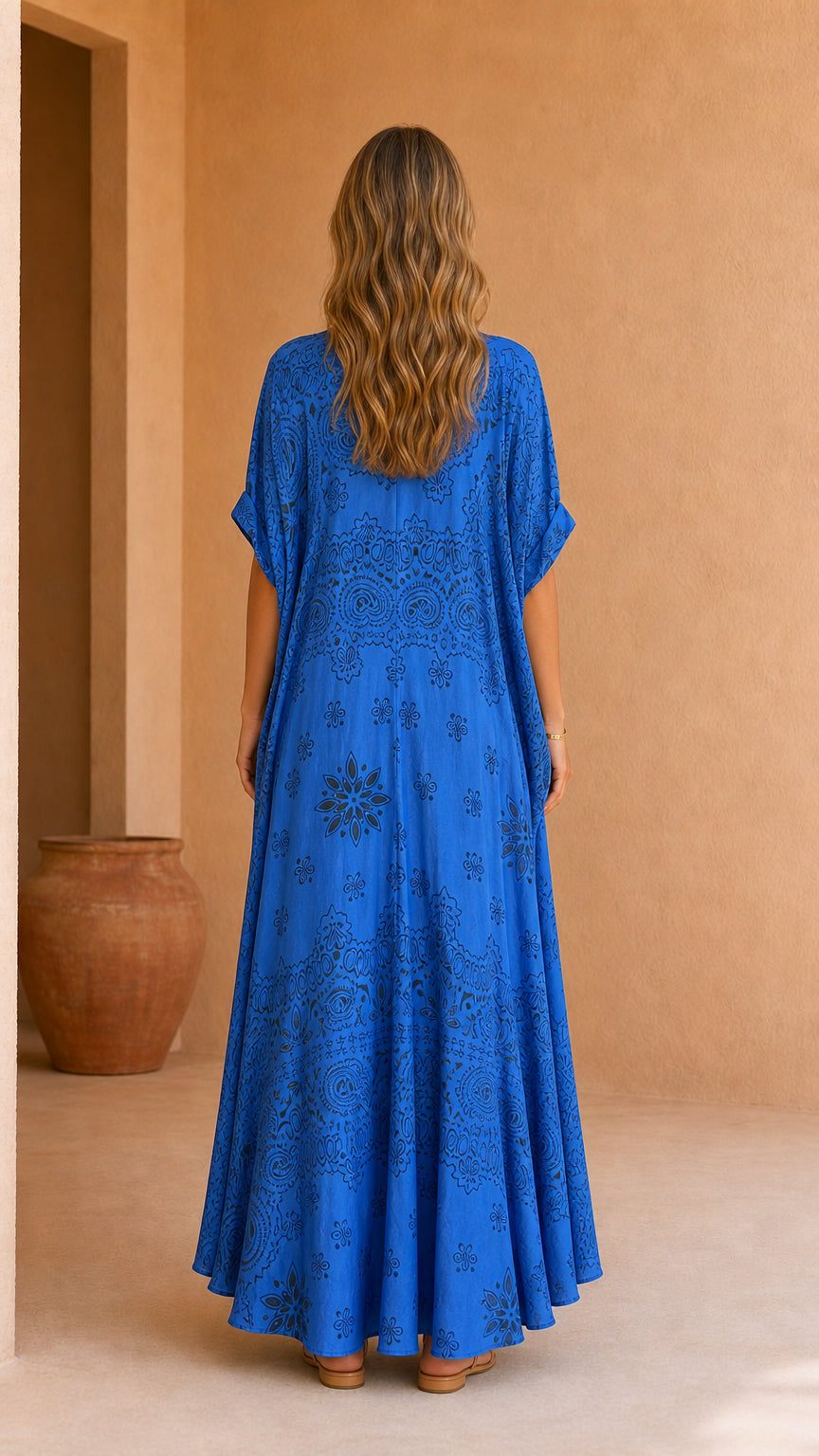 Model wearing blue printed two-piece set, back view