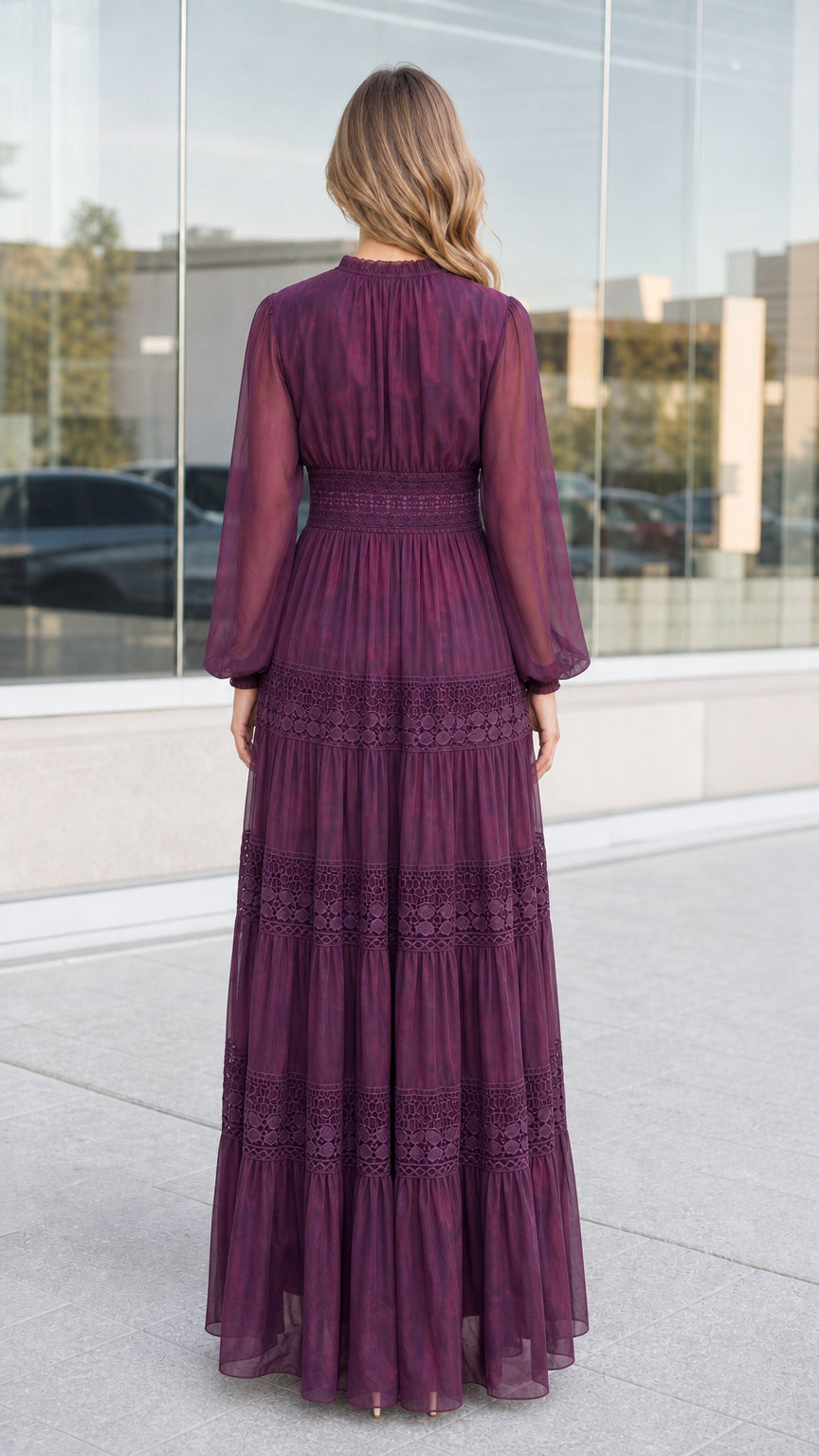 Back full-length view of woman wearing plum lace tiered maxi dress
