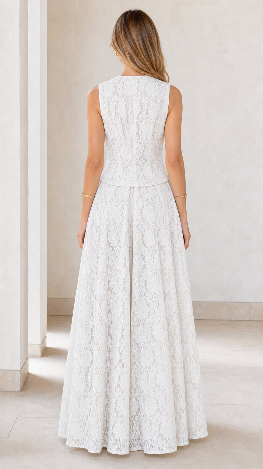 Back view of model wearing white lace vest and wide leg jumpsuit