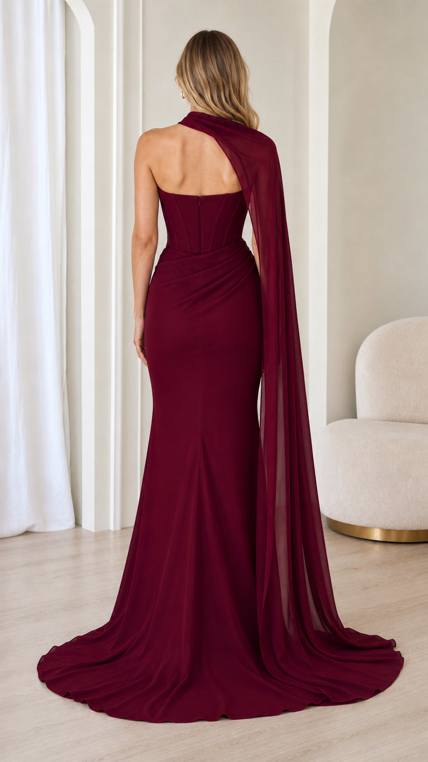Back view of burgundy strapless corset dress with sweeping train