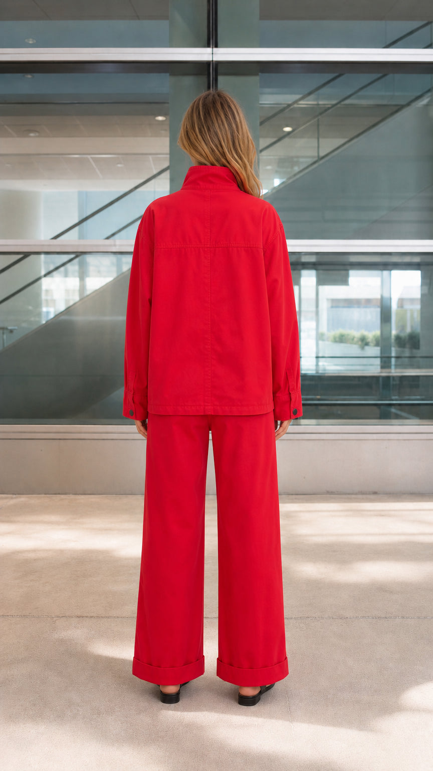 Back view of model wearing the red relaxed-fit two-piece pants set