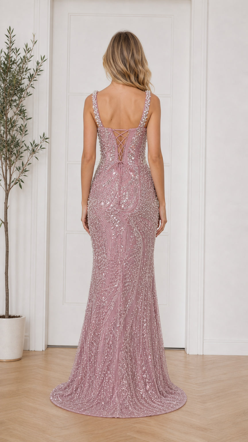 Back view showing lace-up details of dusty pink dress