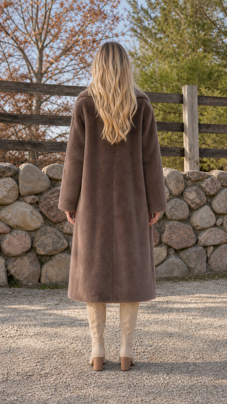 Back view of woman wearing brown faux fur winter coat