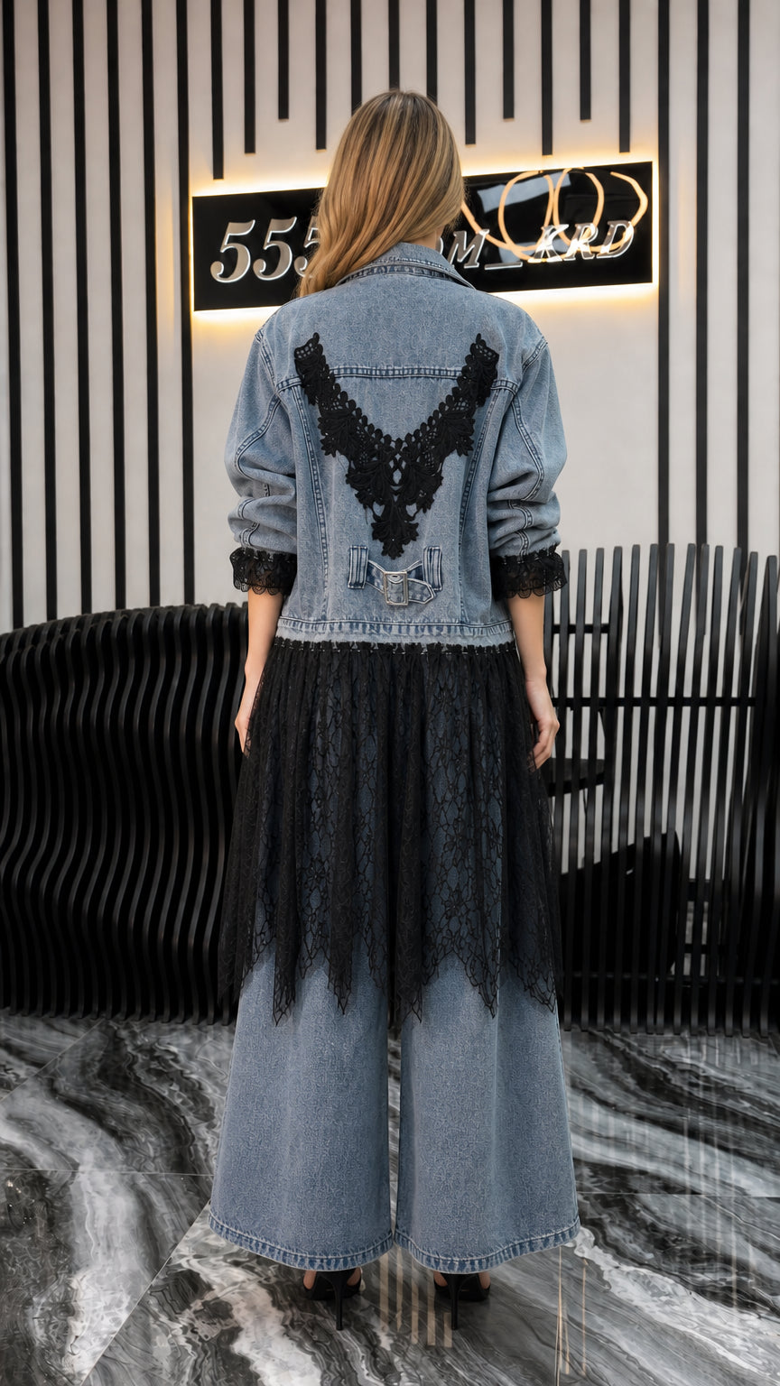 Back view of model showing detailed lace applique on blue denim jacket