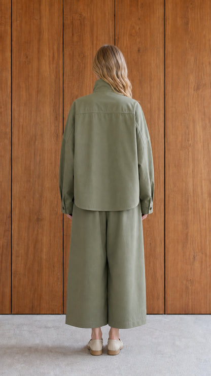 Back view of woman in sage green two-piece set