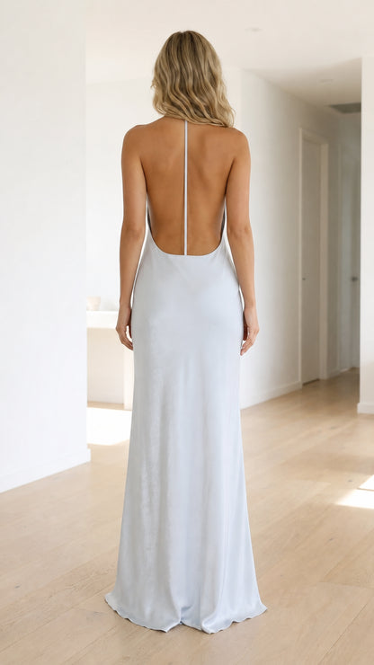 White open-back maxi dress with slim straps and floor-length skirt, back view