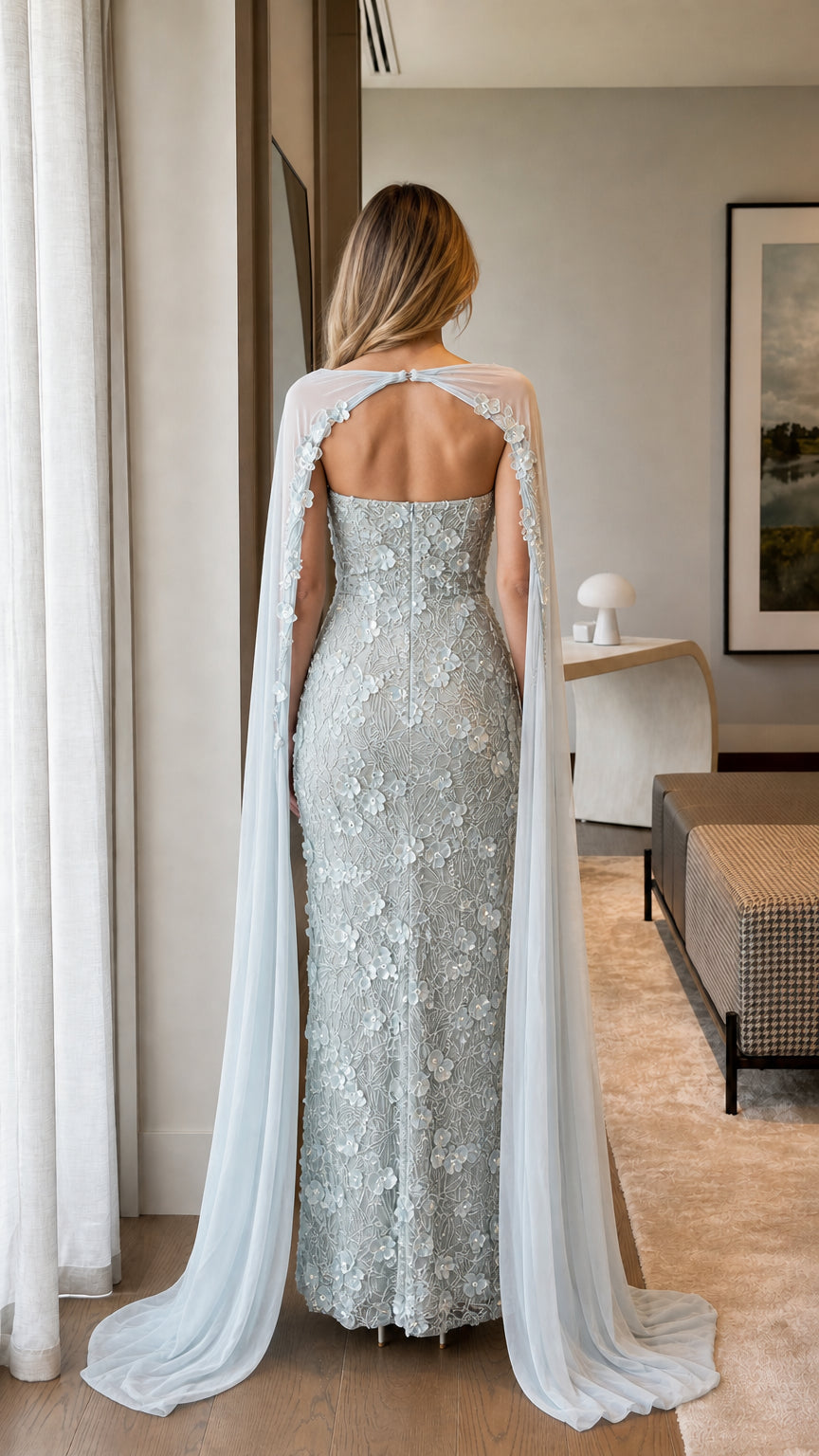 Back view of strapless Ice Blue evening gown featuring long cascading cape train