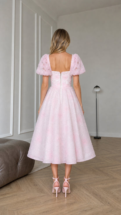 Back view of pink midi dress showing square-cut back detail