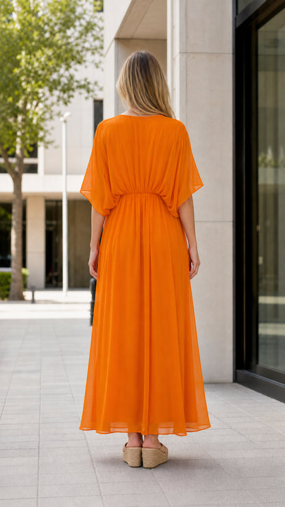 Back view of model wearing orange maxi kaftan dress