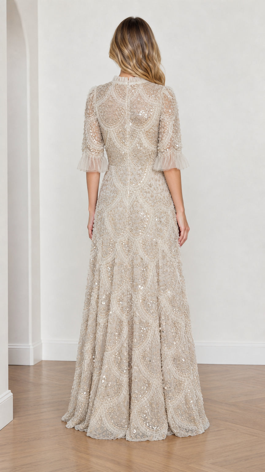 Model wearing Champagne embellished ruffle mock neck maxi dress, back view