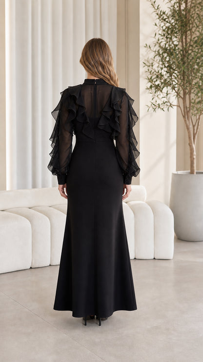 Back view showing sheer detailed upper back of black maxi dress