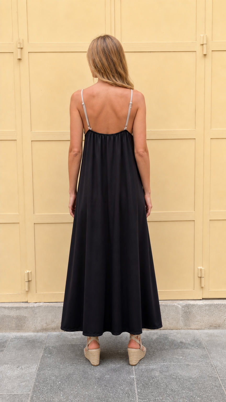 Back view of black contrast maxi dress showing strap detail