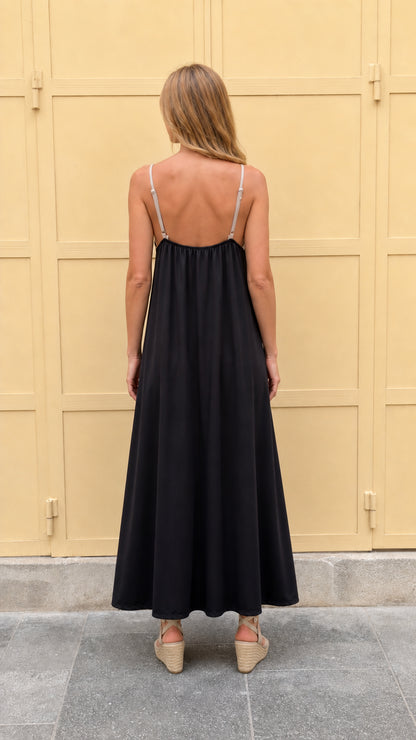 Back view of black contrast maxi dress showing strap detail