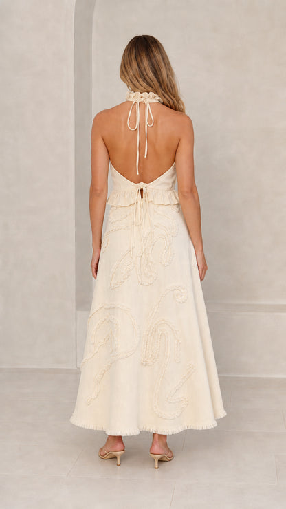 Back view showcasing halter neck tie details in Cream