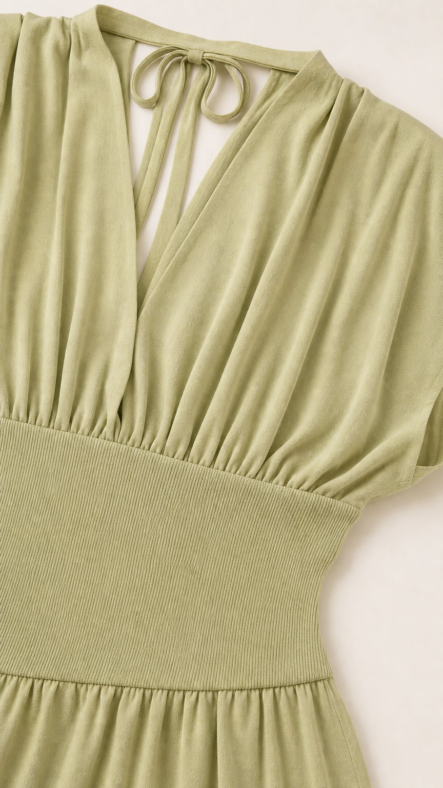 Close-up detail of sage green dress bodice and choker neckline