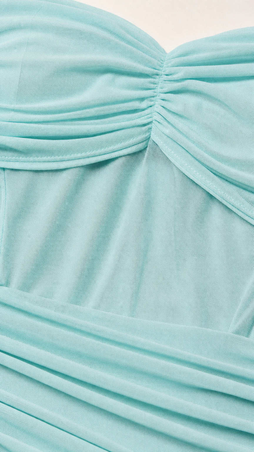 Close up of light blue ruched mesh fabric detail
