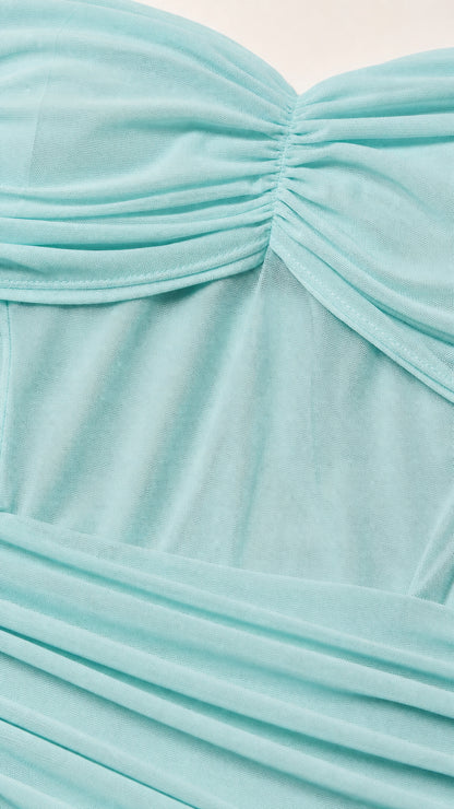 Close up of light blue ruched mesh fabric detail