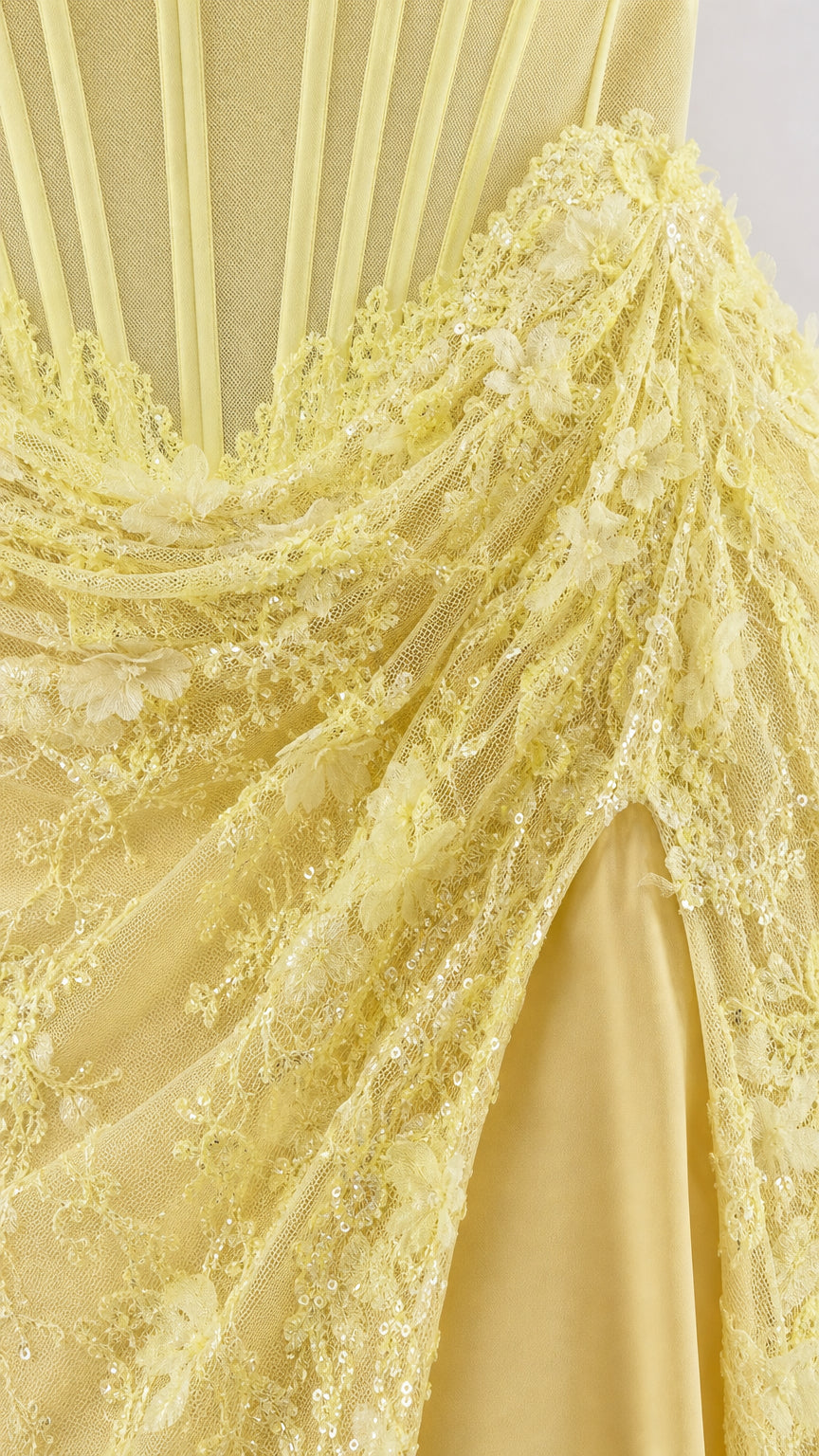 Close-up of yellow 3D floral appliques and structured corset