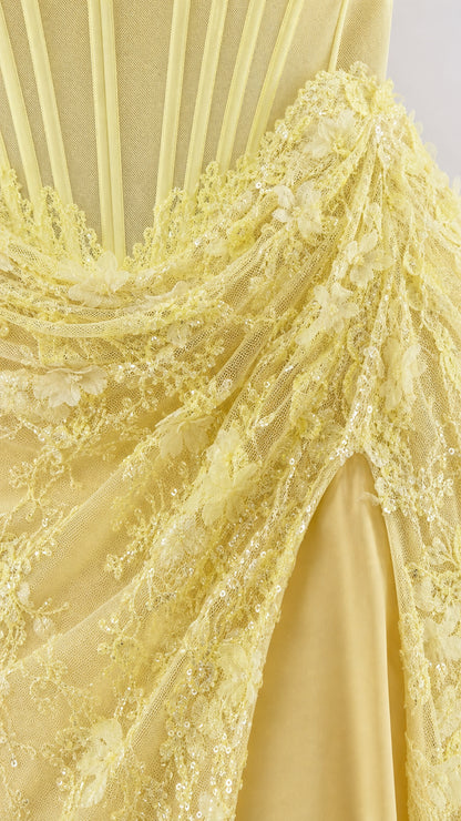 Close-up of yellow 3D floral appliques and structured corset