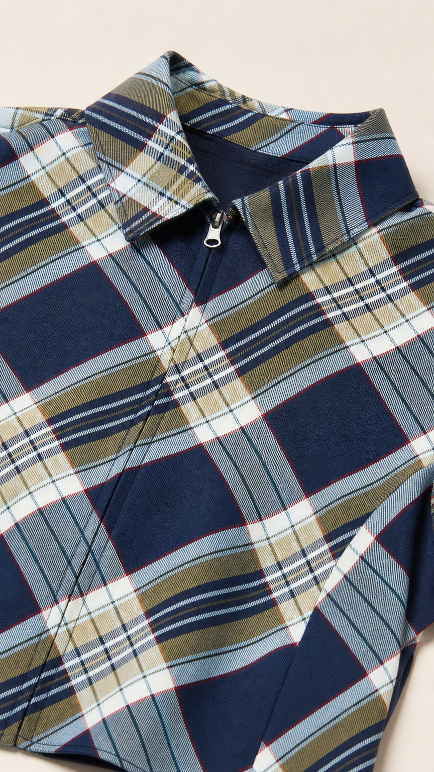 Close-up detail of Navy plaid fabric and half-zip collar