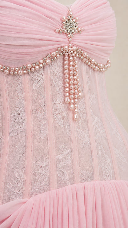 Close-up of bodice with crystal brooch and pearl embellishments
