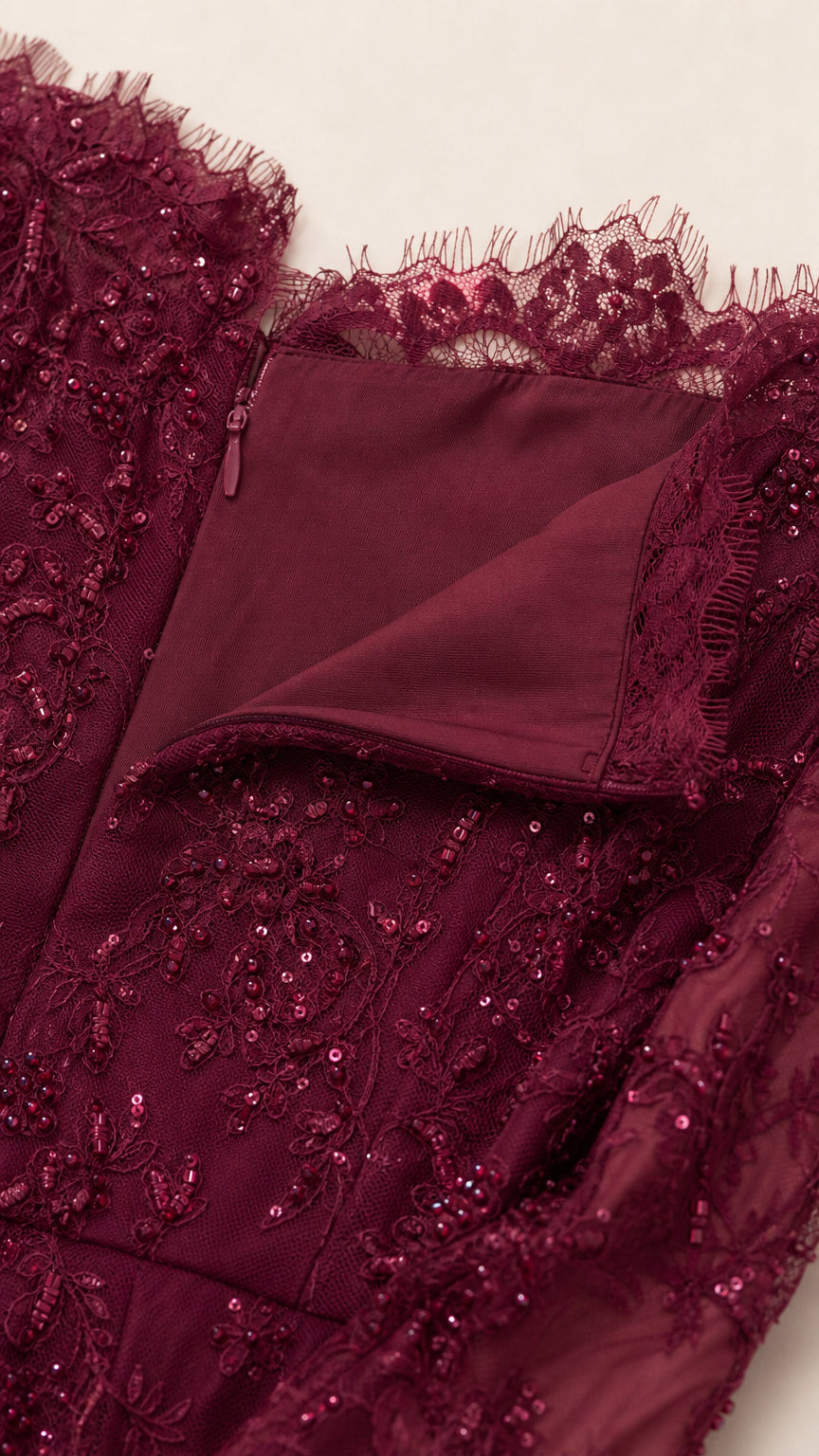 Close-up of neckline, lace texture, and zipper detail