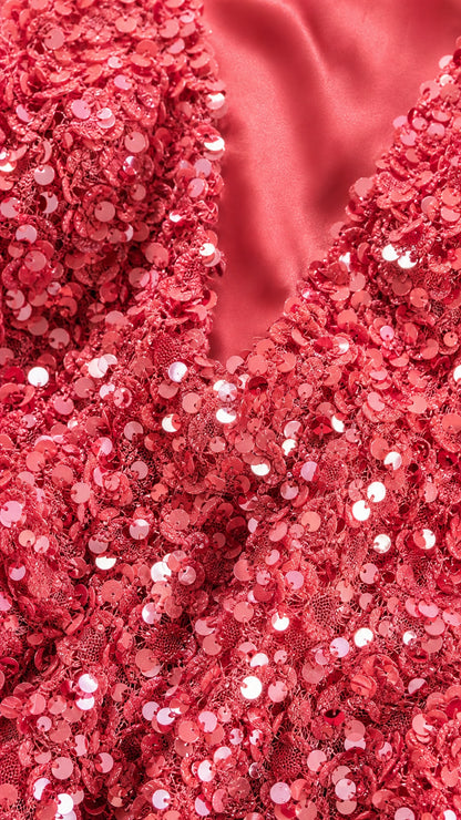 Close up of red sequin fabric texture