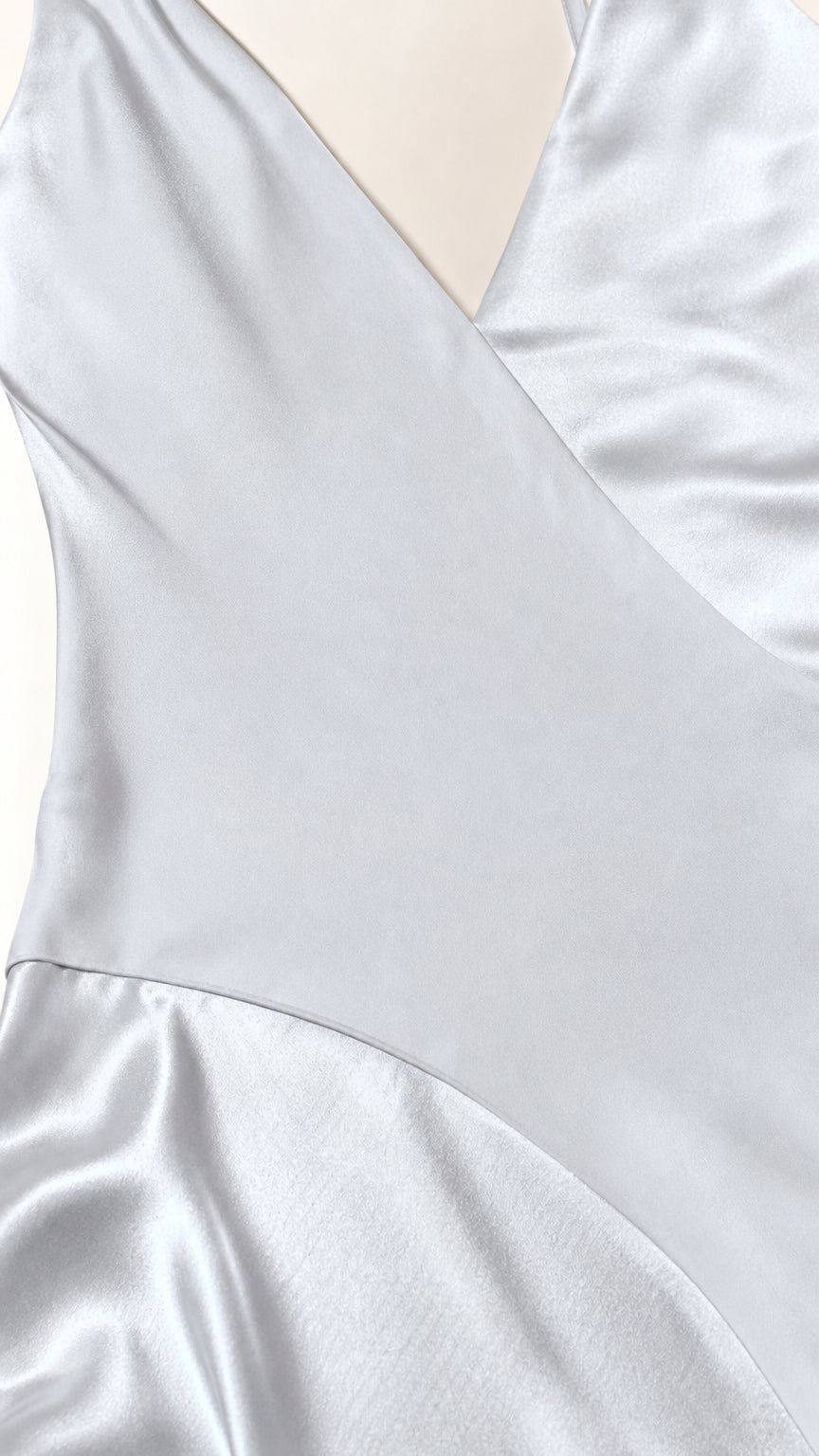 Close-up of the smooth white satin-look fabric and draped finish