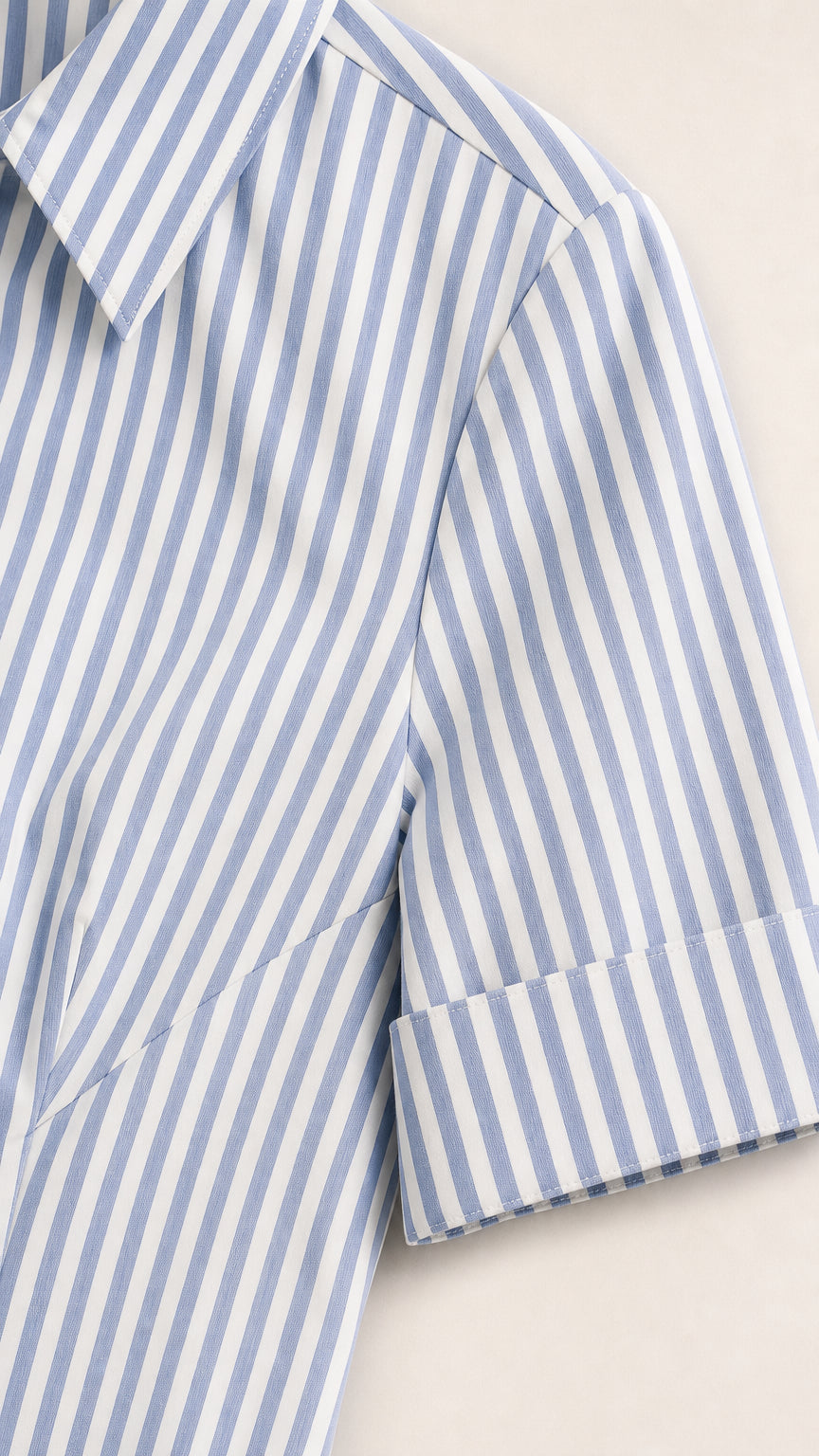 Close-up detail of blue striped sleeve and collar