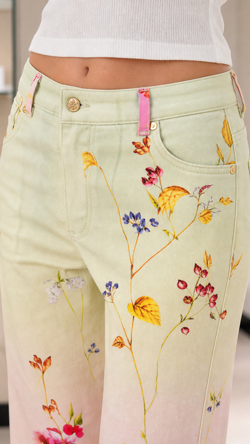 Close-up detail of front waistband, coin pocket, and delicate floral print