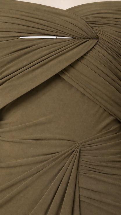 Close-up detail of bodice ruching and metallic accent