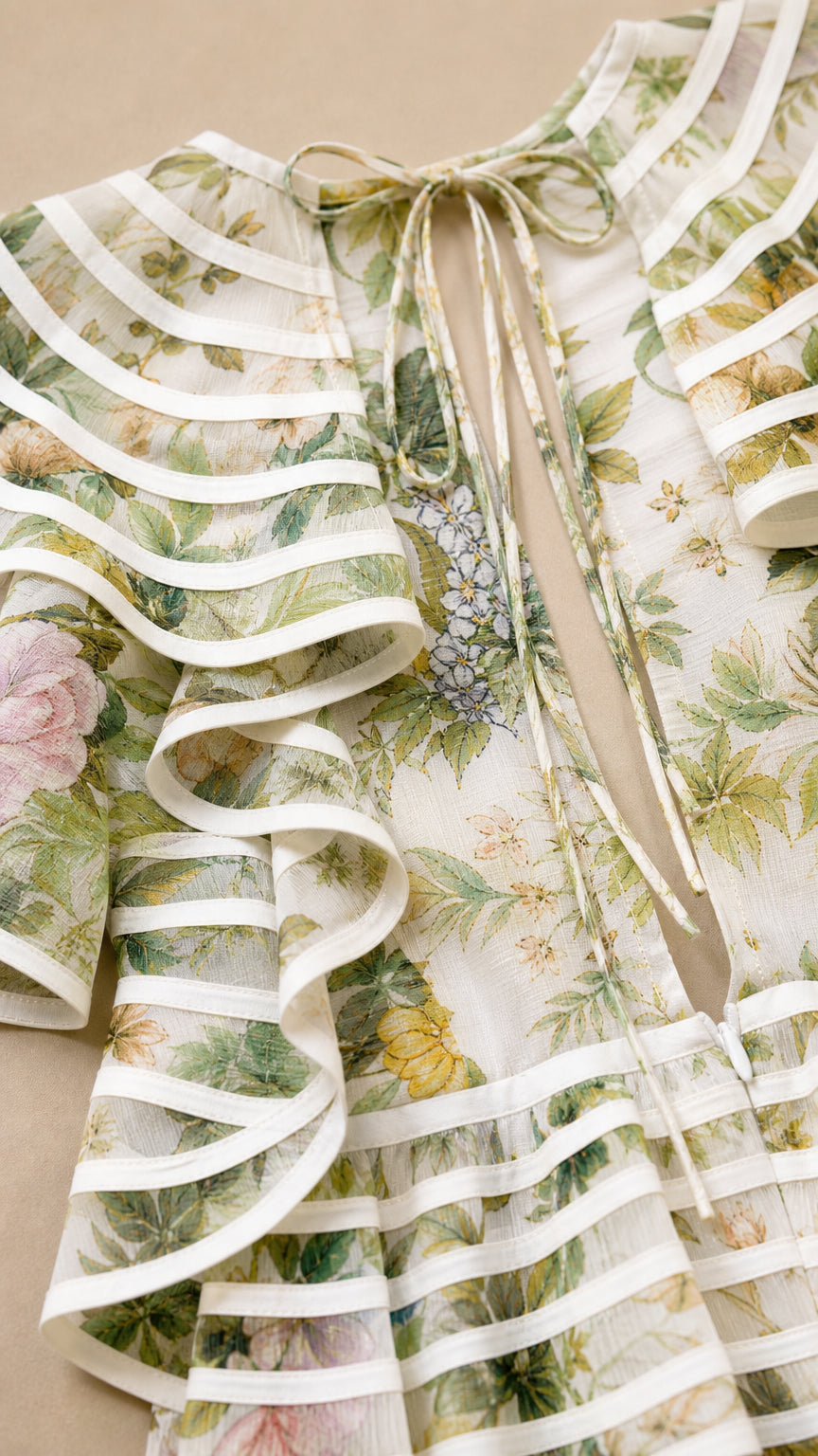 Close-up detail of striped trim ruffles and back tie closure
