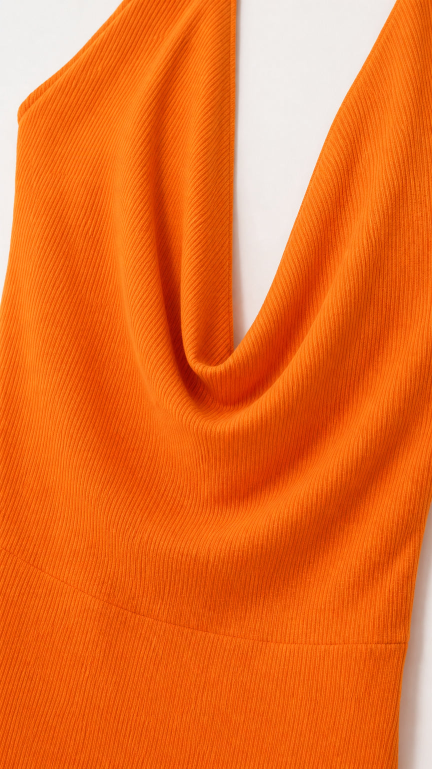Close-up of ribbed texture and cowl neckline on orange dress