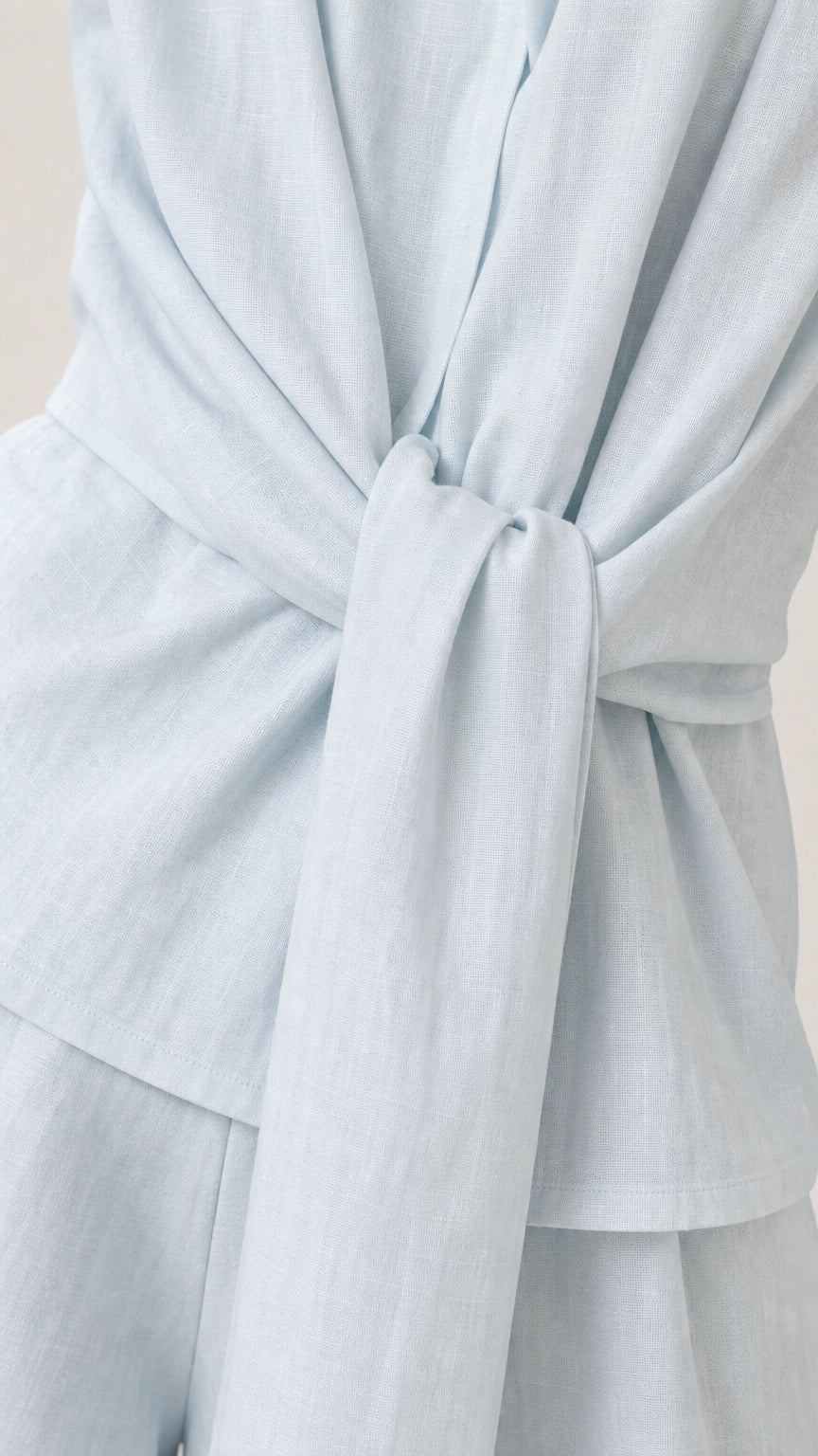 Close-up of the front tie knot on the light blue vest