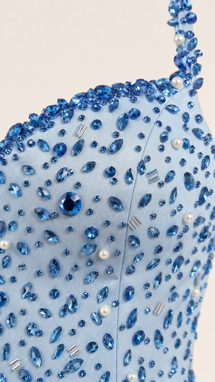 Close-up detail of crystal and pearl beading on gown bodice