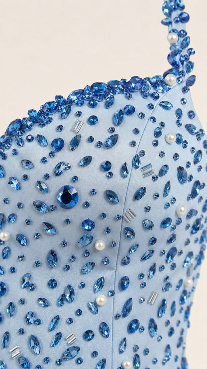 Close-up detail of crystal and pearl beading on gown bodice